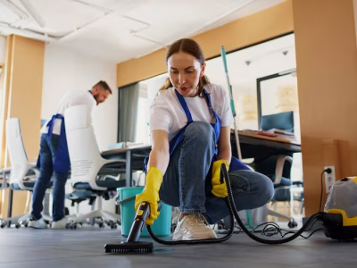 professional-cleaning-service-person-using-vacuum-cleaner-office_23-2150520594